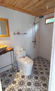 a bathroom with a toilet and a sink at Luckydaisy Buffalo House in Sapa
