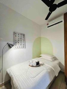 a bedroom with a white bed with a ceiling at NEW Chic Cosy Sepang KLIA KLIA2 5-7 Pax in Sepang