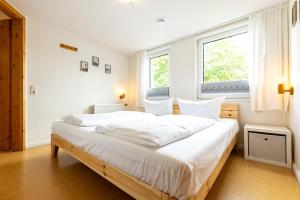 מיטה או מיטות בחדר ב-Appartement EBB