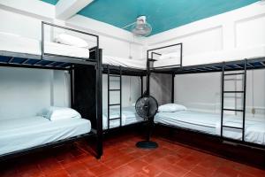 Postel nebo postele na pokoji v ubytování Hostal Victoria