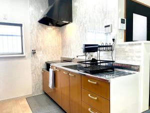 Kuchyň nebo kuchyňský kout v ubytování guesthouse Nakatsu
