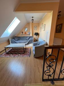 a bedroom with a bed and a couch at Casa din Deal-Cincu in Cincu