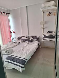 Postel nebo postele na pokoji v ubytování GrandBeach A404 by malai