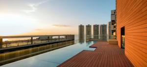 a swimming pool on the roof of a building at Luminous Excellence City Center - PH Quartier Atlapa in Panama City