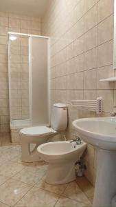 a bathroom with a toilet and a sink at MAGNOLIA Duszniki Zdrój in Duszniki Zdrój +18 photos