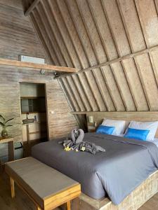 Postel nebo postele na pokoji v ubytování Kuri Garden Cottage + 37 fotografií