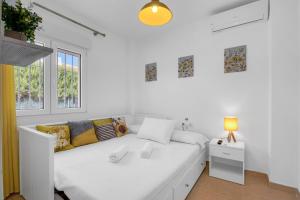 Ένα ή περισσότερα κρεβάτια σε δωμάτιο στο Preciosa Denia +17 φωτογραφίες