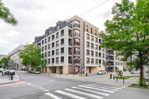 a rendering of a building on a city street at Gąsiorowskich Beige Apartment in Poznań