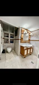 a bathroom with a sink and a toilet at Luxury Apartment Sea View Chalkida in Chalkida