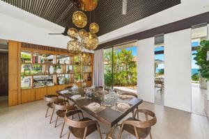 a dining room with a table and chairs at Villa Raku in Koh Samui +57 photos