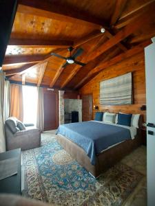 a bedroom with a bed and a couch in a room at Herceg Vila in Trebinje