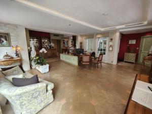 a living room with a couch and a table at Le Relais Médicis in Paris