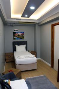 a bedroom with a bed in a room at biglife hotel in Istanbul