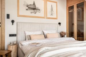 Posteľ alebo postele v izbe v ubytovaní Salamandra Chalet Kościelisko