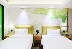 Letto o letti in una camera di Hampton by Hilton Zhuhai Cheng Feng Plaza