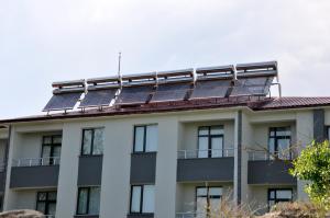 a building with solar panels on the roof at Arpaçay Apart Otel in Kars