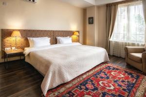 Postel nebo postele na pokoji v ubytování GINGER Hotel
