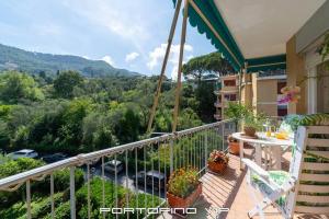 a balcony with a table and chairs and a view at Appartamento Via Madonnetta by PortofinoVip in Santa Margherita Ligure