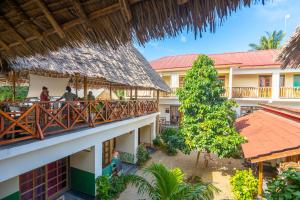 an overhead view of a resort with people sitting on a balcony at La Fontana Zanzibar in Kendwa