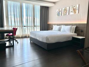 Postel nebo postele na pokoji v ubytování Jazz Hotel Penang