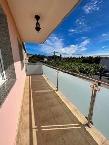 a balcony of a house with a view of the water at Casa Manola in Teo