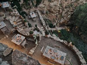 an aerial view of a patio with tables and chairs at The Wild by Interni in Kalafatis