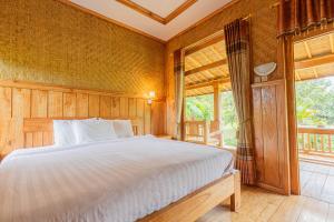 Postel nebo postele na pokoji v ubytování Mulia Garden Bungalows - Monthly Rate Available