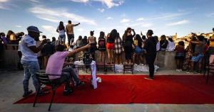 a group of people standing around on a red carpet at Hotel de L'Avenue - Tana City Centre in Antananarivo