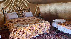Posteľ alebo postele v izbe v ubytovaní CAMP ABDELMOULA