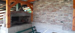 a brick wall with a brick oven in a building at Aura natura in Visoko
