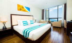 Postel nebo postele na pokoji v ubytování Avatar Danang Hotel