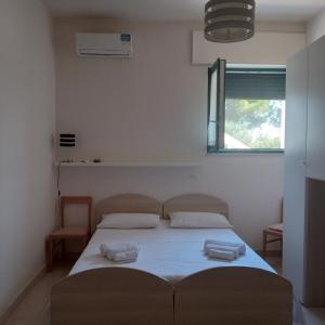 Posteľ alebo postele v izbe v ubytovaní Casa Polinisso