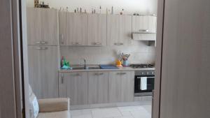 A kitchen or kitchenette at Casa Polinisso