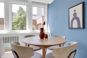a dining room with a table and chairs at Lovely Beacon Hill 1BR BOS-696 in Boston