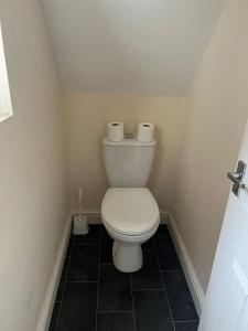 a bathroom with a toilet with two rolls of toilet paper at Alexander Apartments South Shields 2 in South Shields