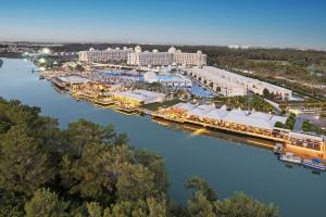 an aerial view of a resort next to a river at Titanic Deluxe Golf Belek in Belek