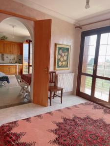 a living room with an open door to a kitchen at Stars Home in Tropea