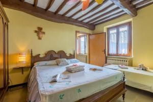 Posteľ alebo postele v izbe v ubytovaní Casale Geniva with Private Pool - Happy Rentals