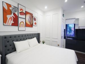 Ein Bett oder Betten in einem Zimmer der Unterkunft Amy Hotel & Apart' Hue