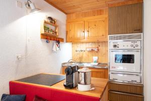 a kitchen with a counter with a coffee maker on it at Rustico Stock - Happy Rentals in Lugano
