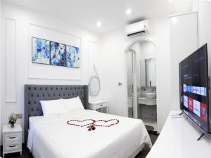 Ein Bett oder Betten in einem Zimmer der Unterkunft Amy Hotel & Apart' Hue