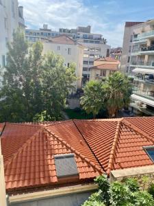 an orange tile roof with a window on top of it at Sublime 3 pièces Hyper Centre Ville de Nice in Nice