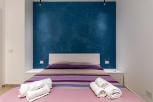 Ένα ή περισσότερα κρεβάτια σε δωμάτιο στο Verdemare a due passi dal mare