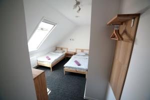 Ένα ή περισσότερα κρεβάτια σε δωμάτιο στο Ubytování Tři Vrby
