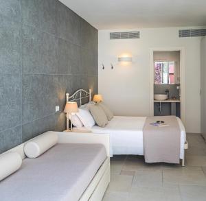 Postel nebo postele na pokoji v ubytování Hotel Giardino Suites&Spa