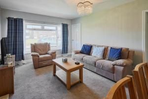 a living room with a couch and a table at Host & Stay - White Rose in Marske-by-the-Sea