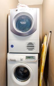a washing machine and a dryer in a room at The Right Choice 1 in Sofia