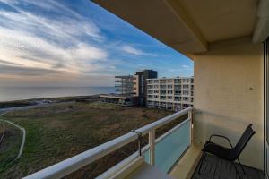 a balcony with a view of the ocean at Appartement Majelle in Egmond aan Zee