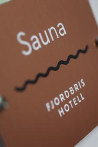 a book with the words sauna and honduras at Fjordbris Hotel in Østhusvik