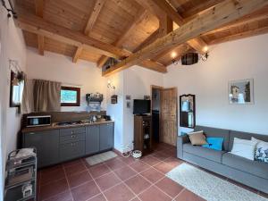 a living room with a couch and a kitchen at CASALE PAGI’ in Grottammare